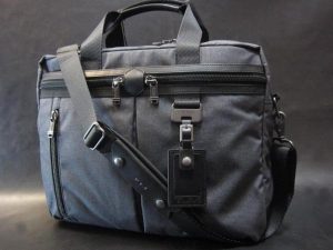 a grey bag with a strap