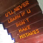 a staircase with orange writing on it