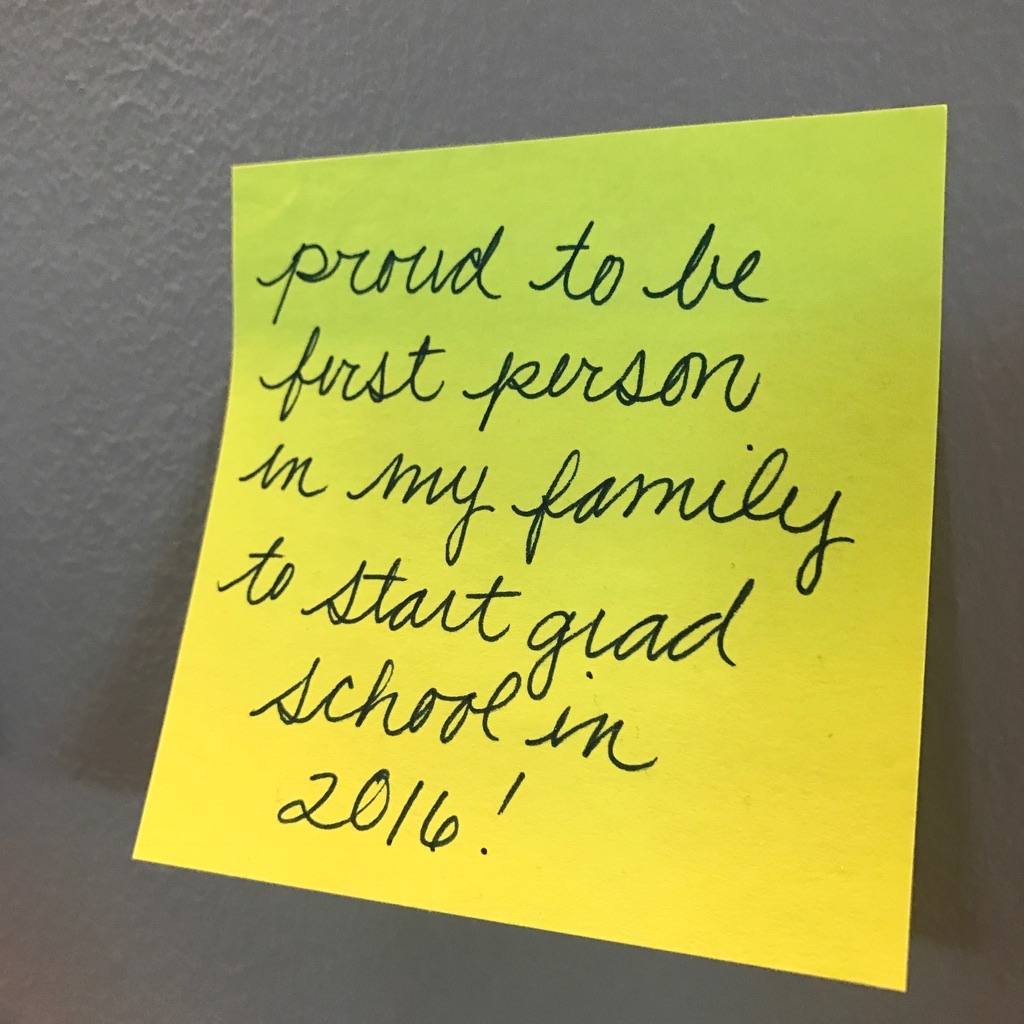 a yellow post-it note on a wall