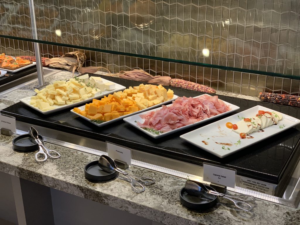 a buffet line of different types of food