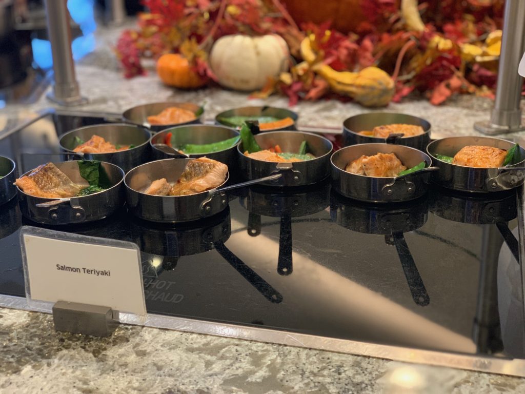 a group of pans of food on a counter