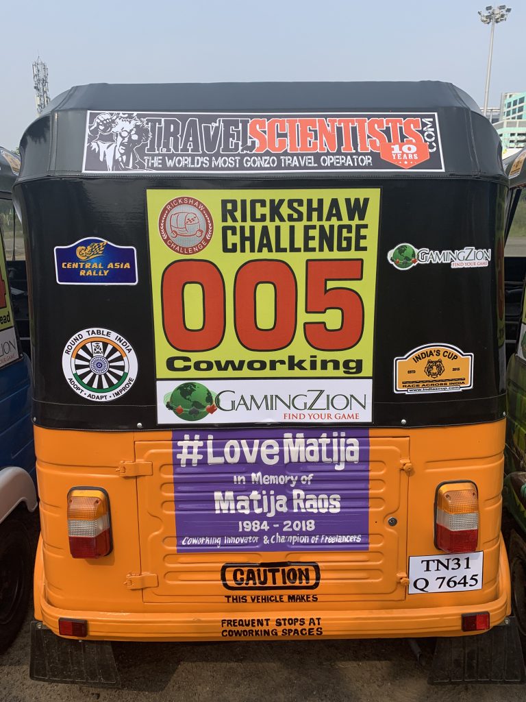 a back of a bus with stickers on it